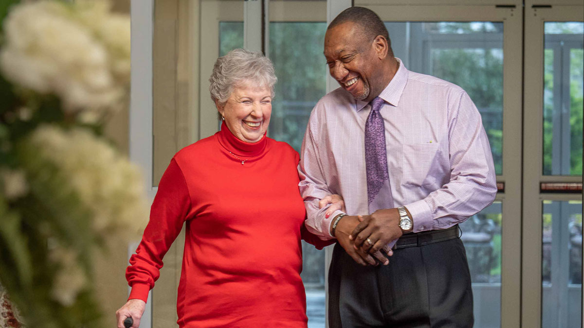 Fairview Estates manager and woman walking