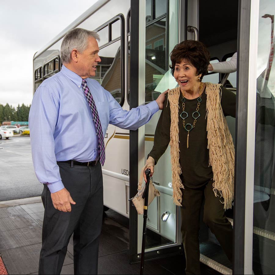 Fairview Estates helping lady off bus